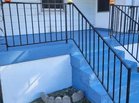 Painted porch steps and rail
