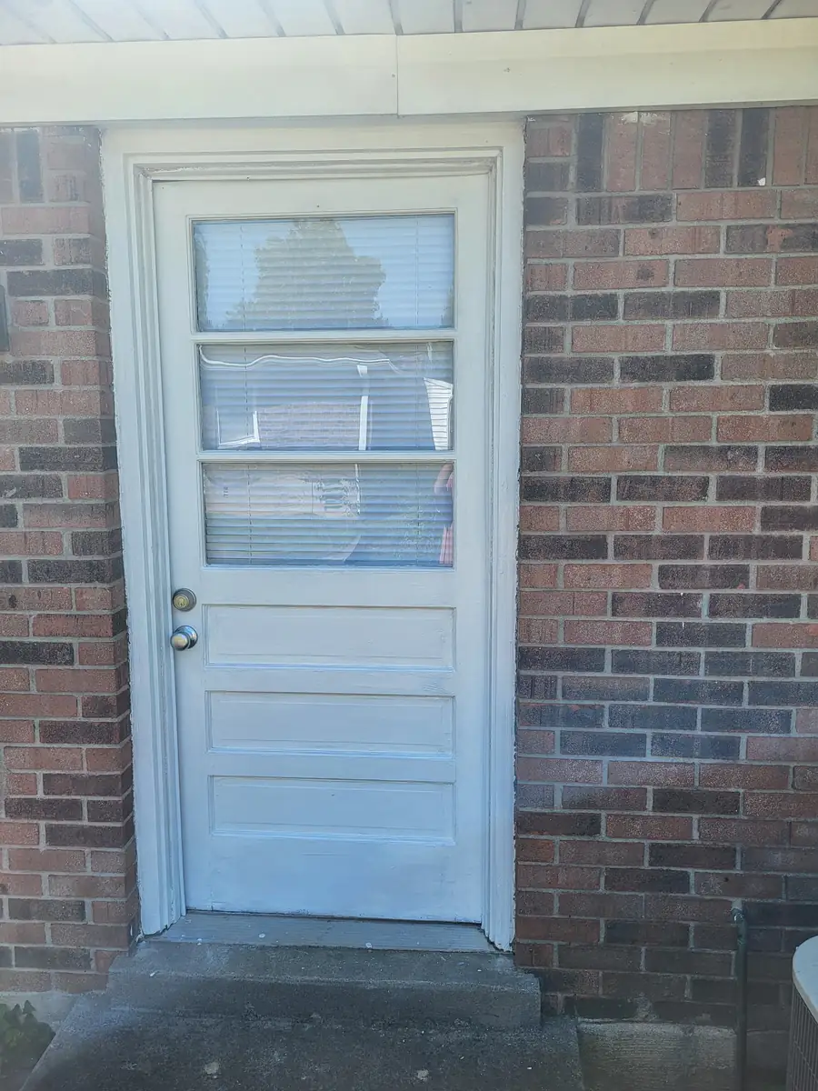 After: Back door, scraped, primed and repainted, by The Tenant Turn