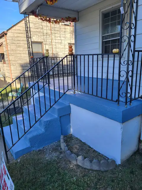 Front steps rebuilt and painted with a new rail