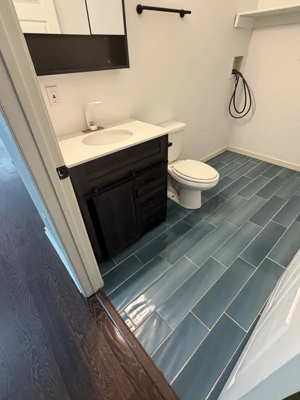 Bathroom with a new tile floor and vanity