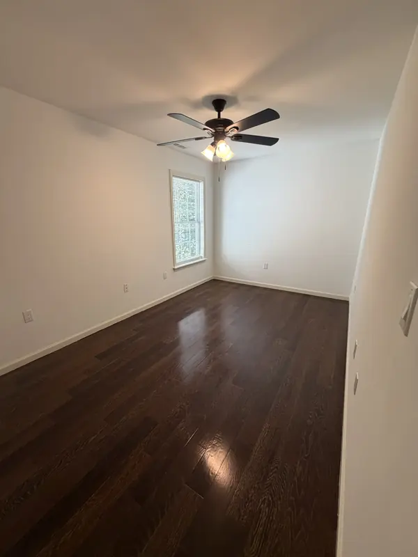 Painted bedroom with a new ceiling fan